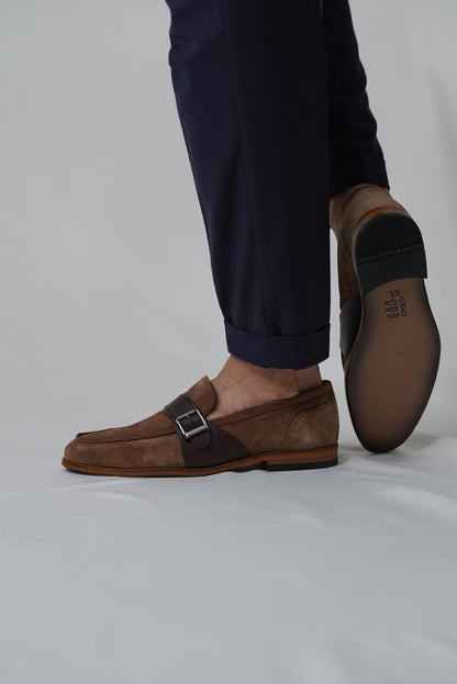 Brown leather dress shoes with a buckle