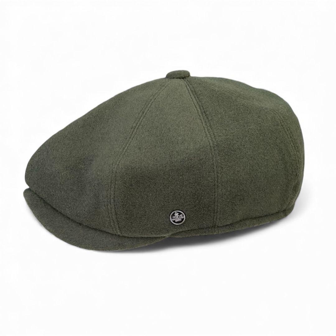 Green newsboy cap on a white background. peaky blinders flat cap