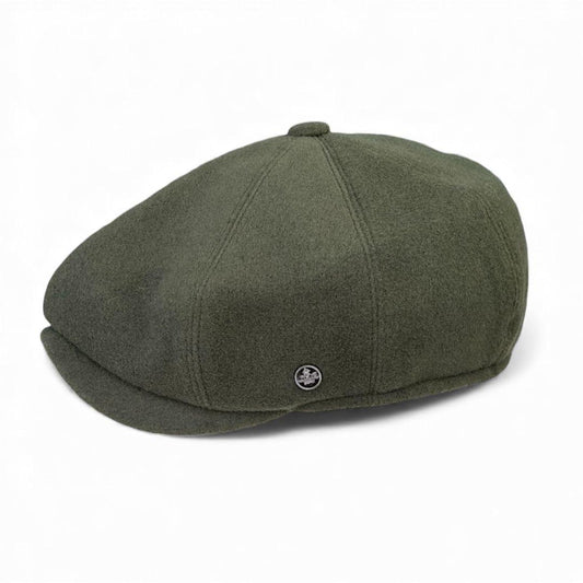 Green newsboy cap on a white background. peaky blinders flat cap